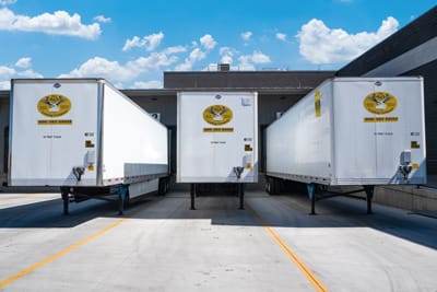 three-white-enclosed-trailers Road Trailers