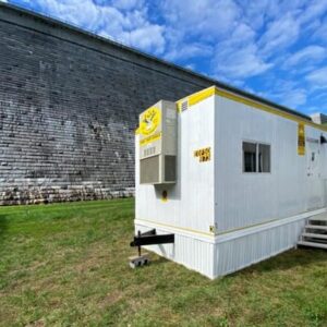 Office Trailer with skirt in front of dam