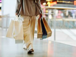 woman with shopping bags during peak season.