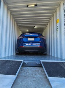 storage-container-with-ramps-and-tesla (1)