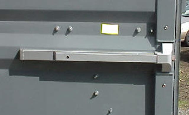 Emergency panic bar exit hardware for office container safety compliance.