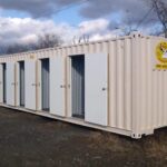 Custom storage container with personnel doors and interior partitions.